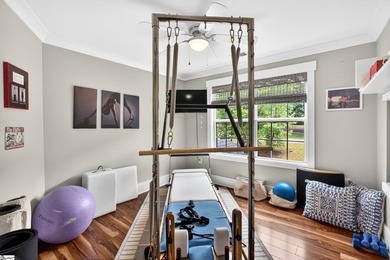 An oversized covered front porch with stained wood ceilings sets - photo 28