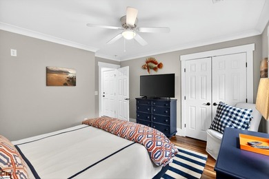 An oversized covered front porch with stained wood ceilings sets - photo 30