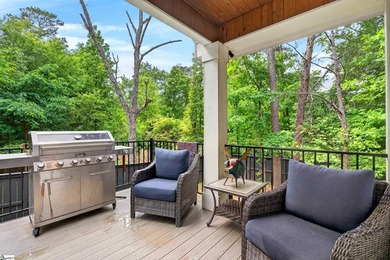 An oversized covered front porch with stained wood ceilings sets - photo 37