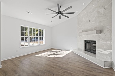 Price Improvement! Beautifully updated 3BR/2BA pond-front home - photo 4