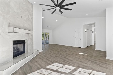 Price Improvement! Beautifully updated 3BR/2BA pond-front home - photo 6