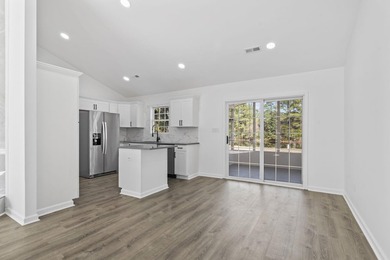 Price Improvement! Beautifully updated 3BR/2BA pond-front home - photo 7