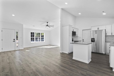 Price Improvement! Beautifully updated 3BR/2BA pond-front home - photo 9