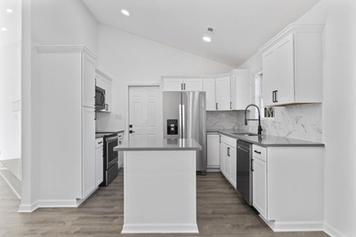 Price Improvement! Beautifully updated 3BR/2BA pond-front home - photo 10