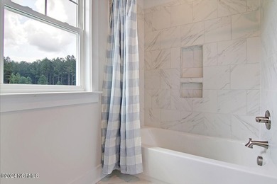 The Webster is a two-story home featuring four bedrooms and - photo 22