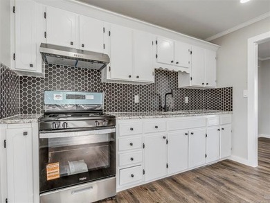 Completely remodeled and move-in ready! This charming