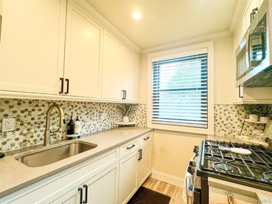 Modern and chic upper corner unit in the highly sought-after - photo 8