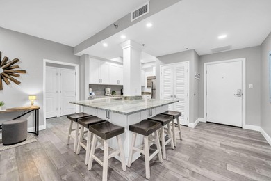This gorgeous condo has been completely remodeled. Stunning open - photo 7