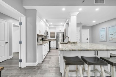 This gorgeous condo has been completely remodeled. Stunning open - photo 8
