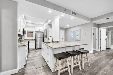This gorgeous condo has been completely remodeled. Stunning open - photo 9