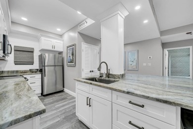 This gorgeous condo has been completely remodeled. Stunning open - photo 10