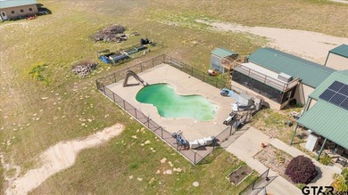 Situated on just over 4 acres in Lindale, this spacious property - photo 1