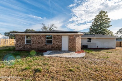 This home offers: 4/2, concrete block construction, ceramic tile - photo 11