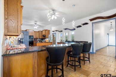 Situated on just over 4 acres in Lindale, this spacious property - photo 10
