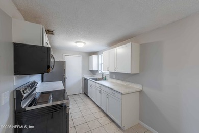 This home offers: 4/2, concrete block construction, ceramic tile - photo 22