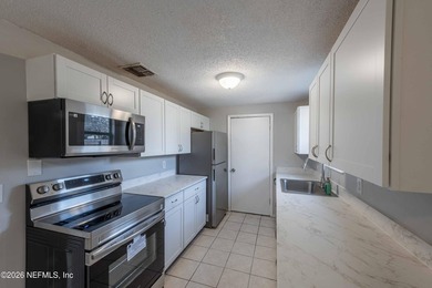 This home offers: 4/2, concrete block construction, ceramic tile - photo 23