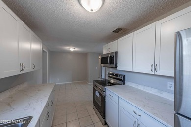 This home offers: 4/2, concrete block construction, ceramic tile - photo 24