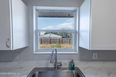 This home offers: 4/2, concrete block construction, ceramic tile - photo 25