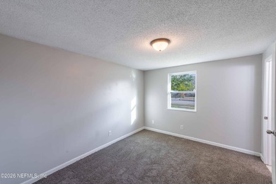 This home offers: 4/2, concrete block construction, ceramic tile - photo 33