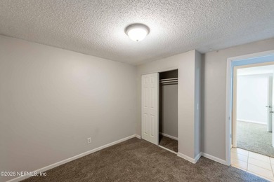 This home offers: 4/2, concrete block construction, ceramic tile - photo 35