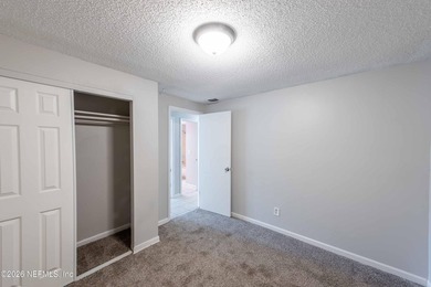 This home offers: 4/2, concrete block construction, ceramic tile - photo 36