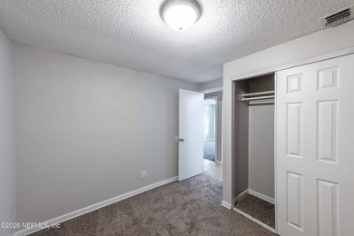 This home offers: 4/2, concrete block construction, ceramic tile - photo 39