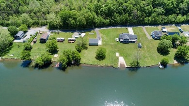 Enjoy nearly an acre of level waterfront property where the - photo 5