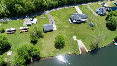 Enjoy nearly an acre of level waterfront property where the - photo 7