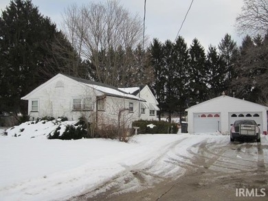 Charming 2 BR 1 Bath Ranch with 2 car detached garage is looking