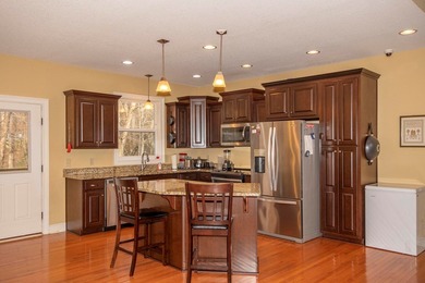 This exceptional creekfront home offers the comforts of