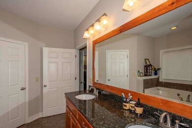 This exceptional creekfront home offers the comforts of