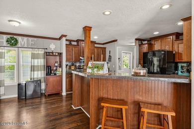 Welcome home to this spacious 4-bedroom, 2-bath manufactured - photo 12