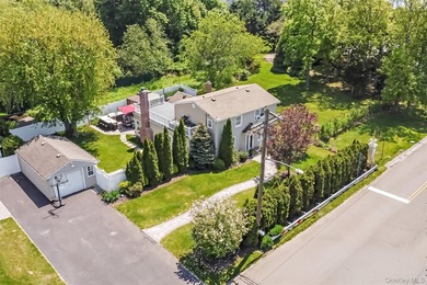 Welcome to this beautifully updated expanded Cape nestled in the - photo 2