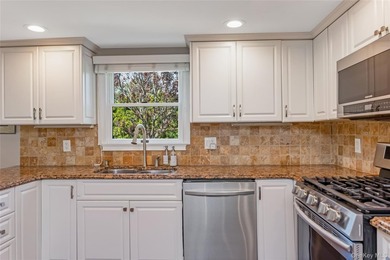 Welcome to this beautifully updated expanded Cape nestled in the - photo 8