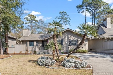 This beautifully updated residence offers laminate wood flooring - photo 1