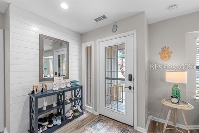 This beautifully updated residence offers laminate wood flooring - photo 6