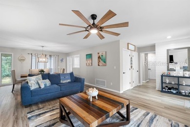 This beautifully updated residence offers laminate wood flooring - photo 10