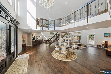 Welcome to this grand 7-bedroom manor located in the prestigious - photo 3