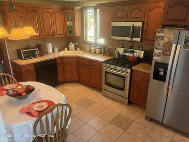 THIS BEAUTIFULLY MAINTAINED 2 FAMILY DETACHED HOME ON ONE OF THE - photo 9
