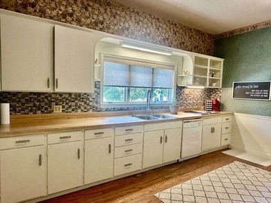 Situated on 5.2 acres+/- with stocked pond and country living - photo 40