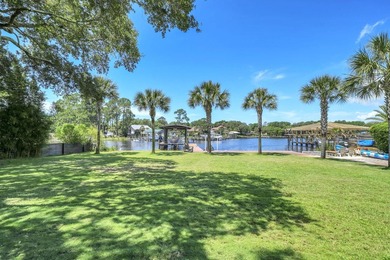 UNDER CONTRACT, TAKING BACKUP OFFERS. Tucked away on beautiful - photo 1