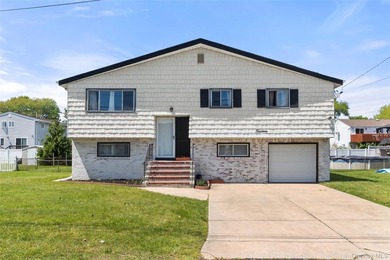 Oversized high ranch located south of Montauk Highway in - photo 1