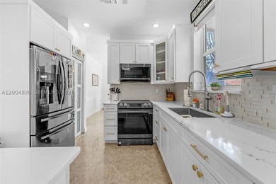 This 4-bedroom, 3-bath two-story home at 13891 SW 39th Ter - photo 9