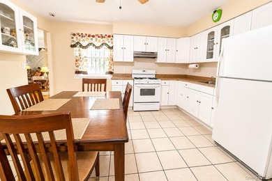 After 45 years, this charming semi-detached brick townhouse is - photo 8