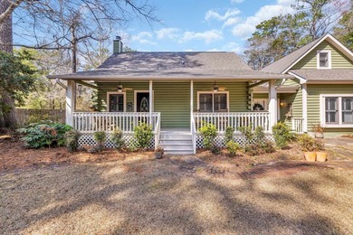 Situated beneath towering oak trees on a secluded one-acre - photo 2