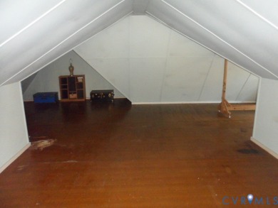 Welcome home to this brick cape cod with a slate roof in the