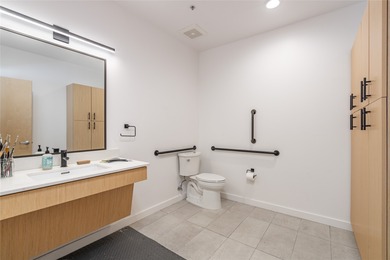 Corner unit with a wraparound balcony and mountain views in