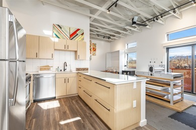 Corner unit with a wraparound balcony and mountain views in