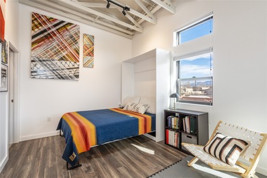 Corner unit with a wraparound balcony and mountain views in