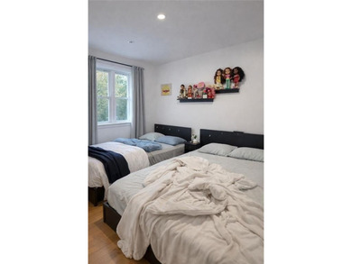 A beautifully renovated two-family residence in the heart of - photo 14